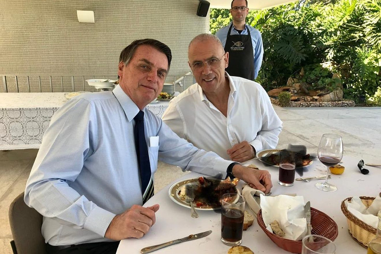 Israel’s Ambassador to Brazil Yossi Shelley dining with Brazilian President Jair Bolsonaro. The picture features a poorly doctored covering up (with black X marks) of the two men eating lobsters, which is forbidden under Jewish dietary law and sparked a minor controversy in Israel. Credit: Twitter.