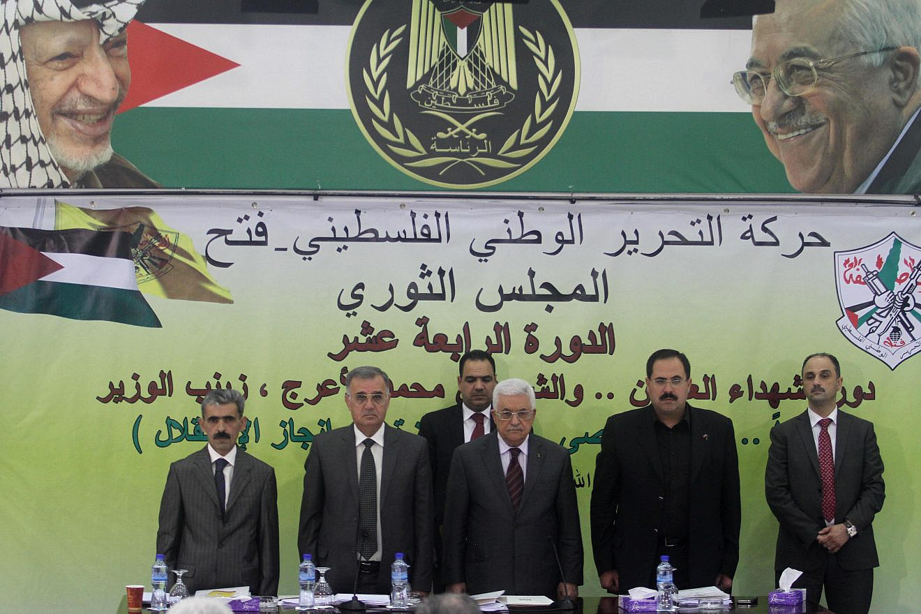 Palestinian leader Mahmoud Abbas (center) delivers a statement at a conference in Ramallah on Oct. 18, 2014. Photo by Flash90.