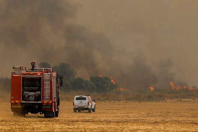 Firefighters try to extinguish a forest fire near Moshav Aderet on July 17, 2019. Photo by Noam Revkin Fenton/Flash90.