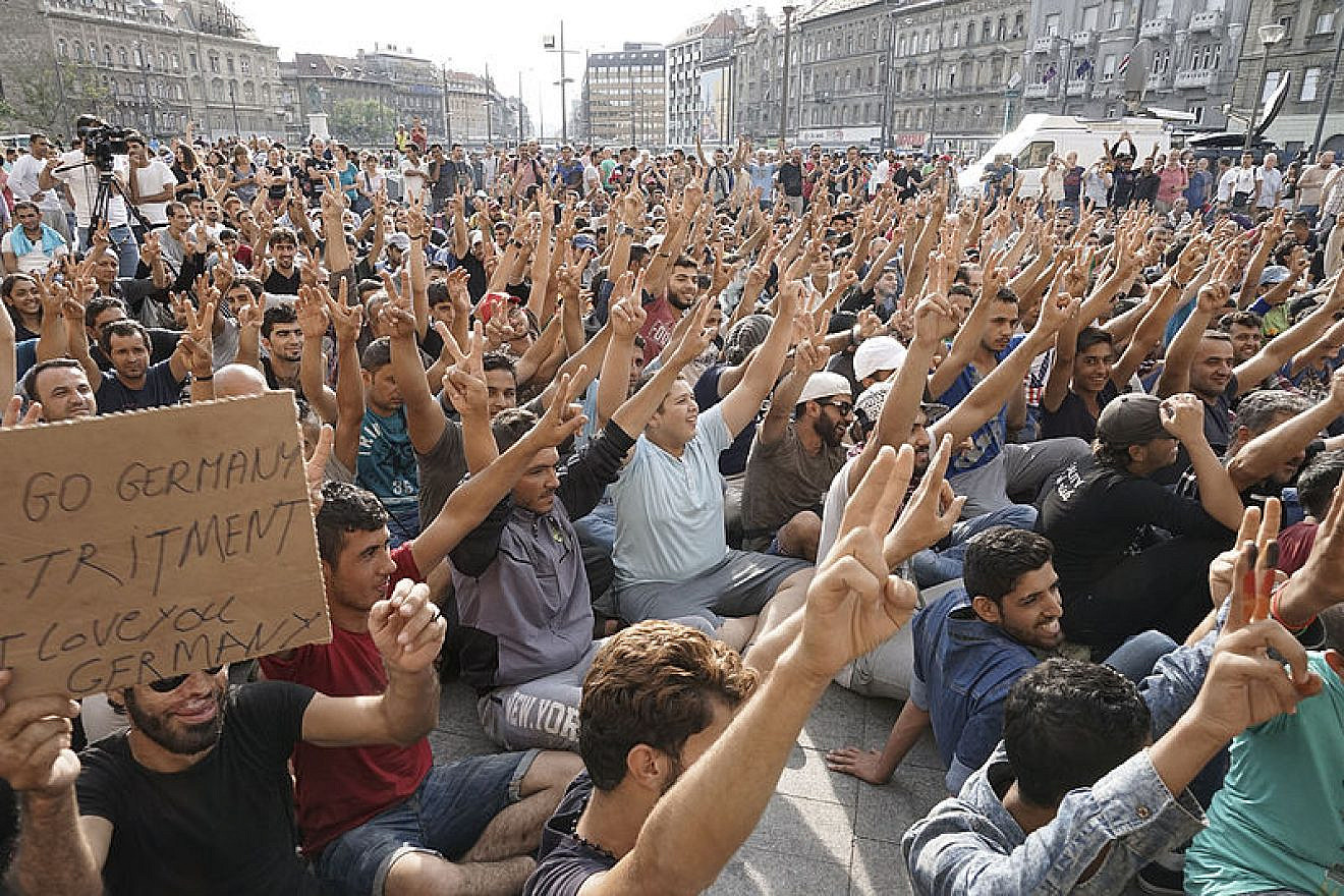 Young Syrian males refugees strike in front of the Budapest Keleti railway station in Budapest, Hungary, on Sept. 3, 2015. Credit: Mstyslav Chernov via Wikimedia Commons.