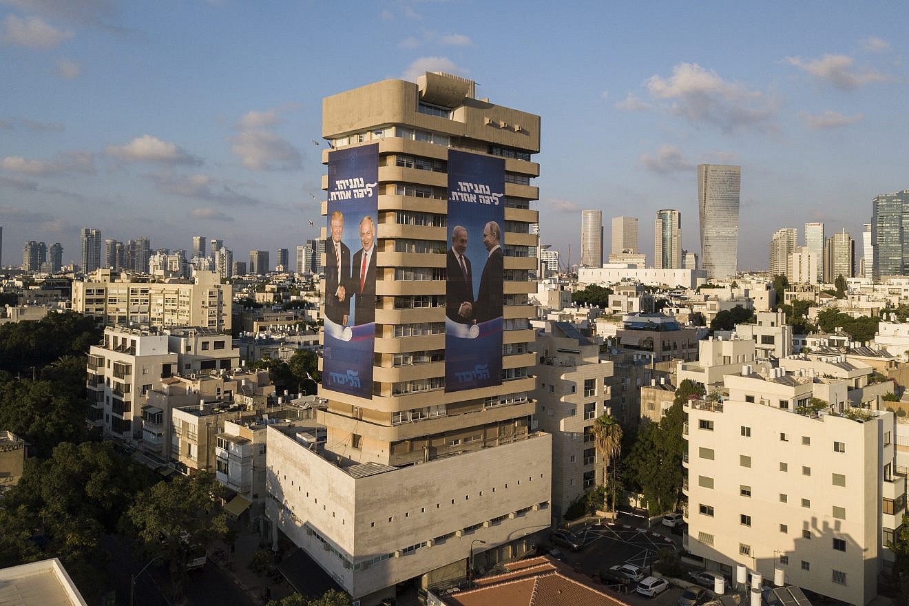 Election campaign posters on Likud Party headquarters in central Tel Aviv show Israeli Prime Minister Benjamin Netanyahu shaking hands with Russian President Vladimir Putin and U.S. President Donald Trump; others show Netanyahu and Prime Minister of India Narendra Modi, July 28, 2019. Photo by Adam Shouldman/Flash90.