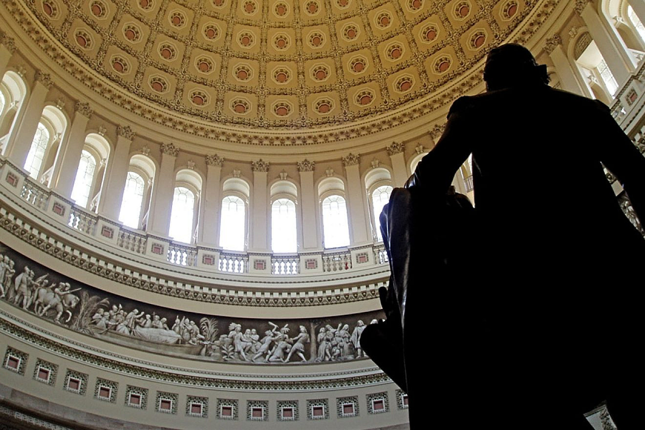 The interior of the U.S. Capitol rotunda, taken from behind the statue of George Washington. Credit: Wikimedia Commons.