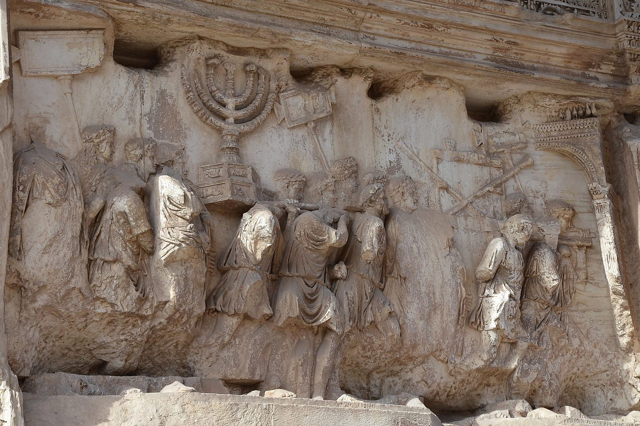 The Arch of Titus in Rome. The arch contains panels depicting the triumphal procession celebrated in 71 C.E. after the Roman victory culminating in the fall of Jerusalem, which is mourned on the Jewish holiday of Tisha B'Av. Credit: Flickr.