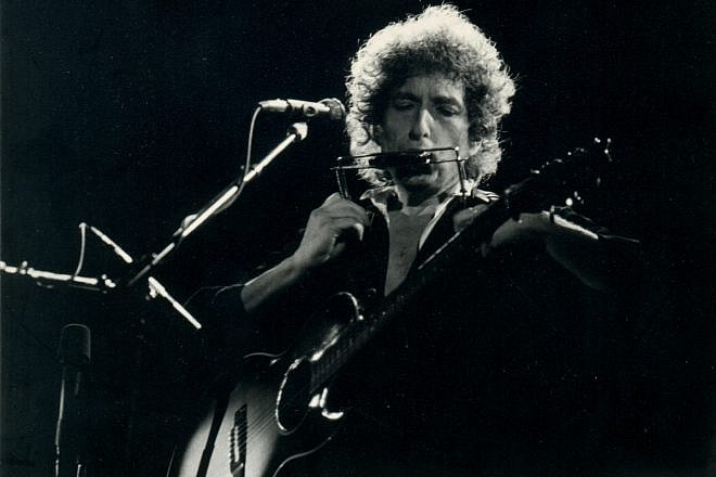 American folk singer-songwriter Bob Dylan performing. Credit: Flickr.