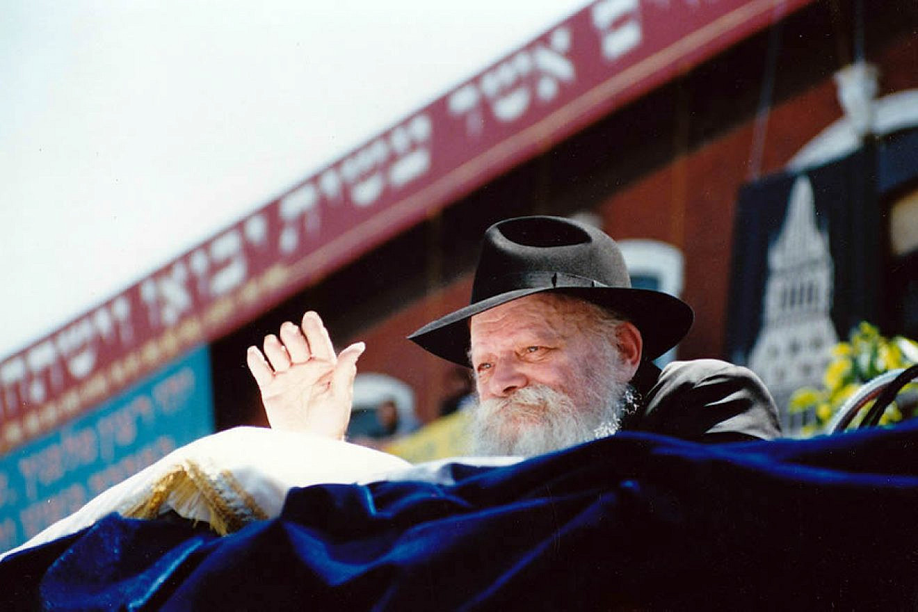 The Lubavitcher Rebbe, Rabbi Menachem Mendel Schneerson, waves to children at a Lag B'Omer parade in the Crown Heights neighborhood of Brooklyn, N.Y., on May 17, 1987. Credit: Mordecai Baron via Wikimedia Commons.