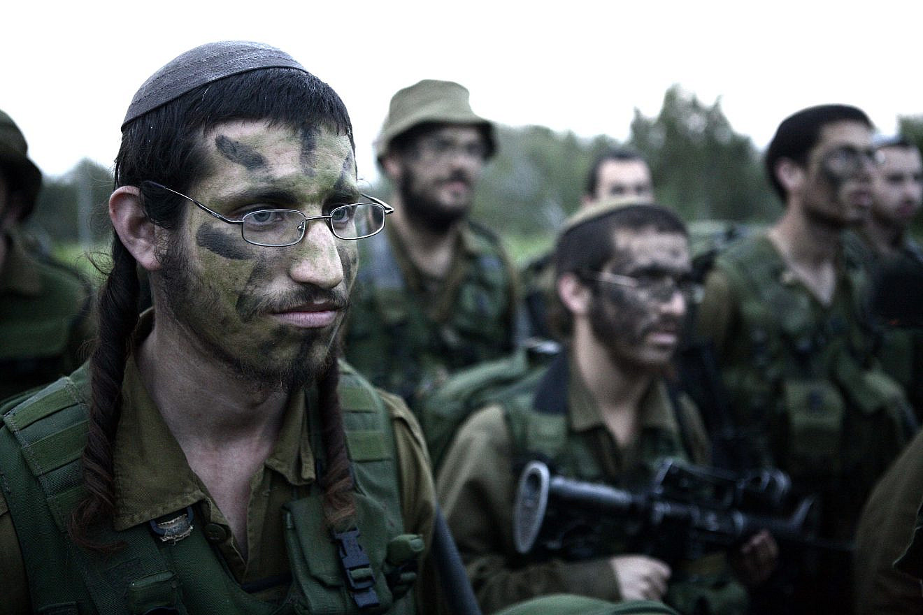 Infantrymen in the IDF's Orthodox Netzah Yehuda (“Nahal Haredi”) Battalion complete the final stages of a 40-kilometer march, Feb. 16, 2010. Photo by Abir Sultan/Flash90.