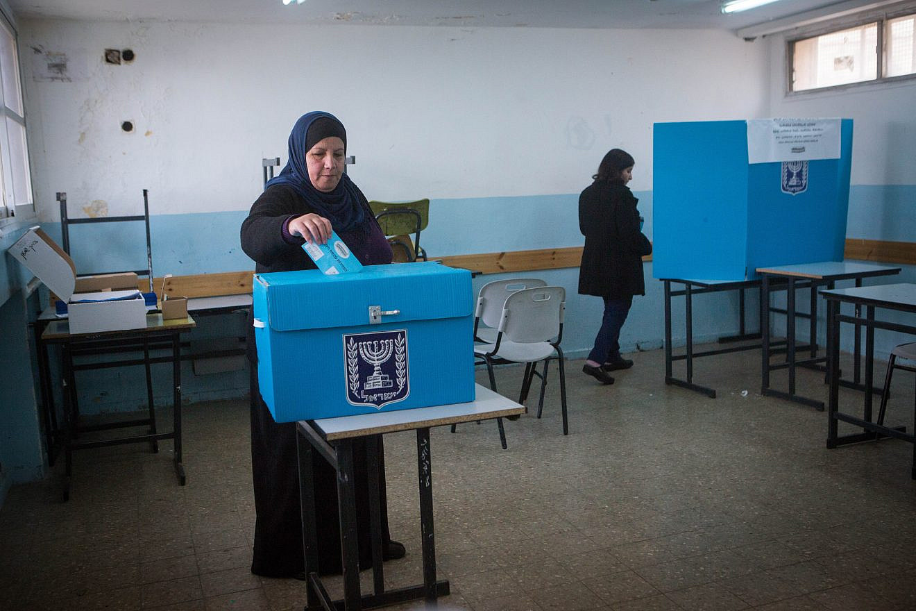 Arab Israelis cast their ballots at a polling station in the town of Beit Safafa during the elections for the 20th Knesset, March 17, 2015. Photo by Miriam Alster/Flash90.