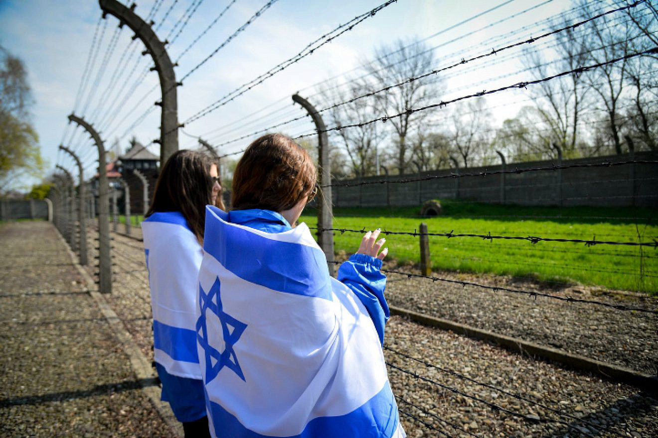 Jewish youngsters in Poland to participate in the annual March of the Living gaze into the Auschwitz-Birkenau camp site, April 16, 2015. Credit: Yossi Zeliger/Flash90.