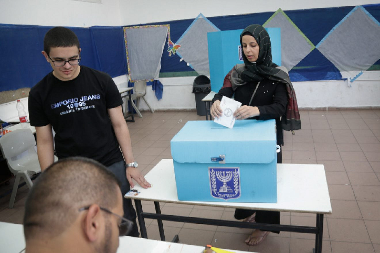 An Arab-Israeli woman casts her ballot at a voting station during municipal elections on Oct. 30, 2018, in Kafr Qasim. Photo by Roy Alima/Flash90.