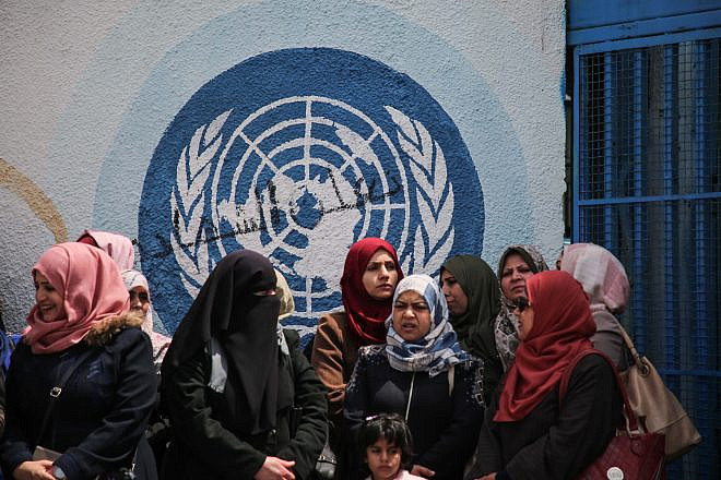 UNRWA staff members protest against cuts in financial aid outside the agency's offices in Gaza City on April 14, 2019. Photo by Hassan Jedi/Flash90.