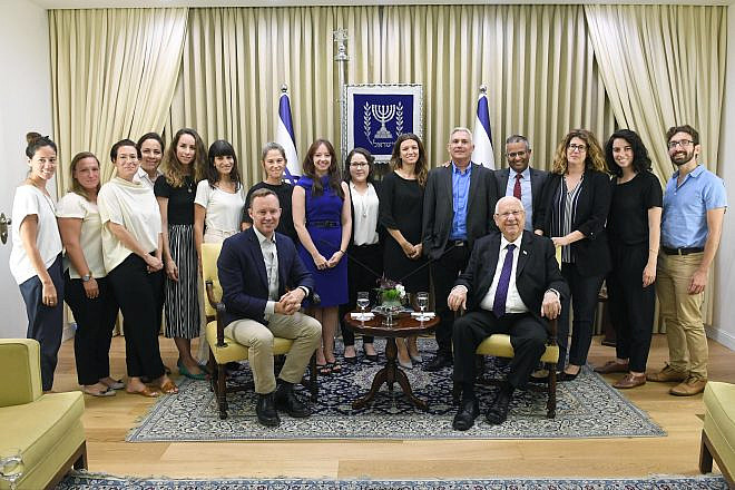 Israeli President Reuven Rivlin (seated at right) with innovation team members representing the Bloomberg Foundation and Peres Center for Peace. Credit: Mark Neiman/GPO.