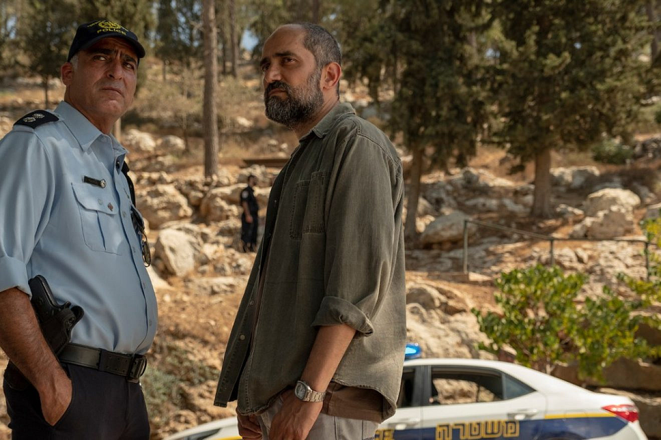 A member of the Israeli police and a Shin Bet Israeli security officer stand next to each other in a scene in HBO's "Our Boys." Credit: HBO.