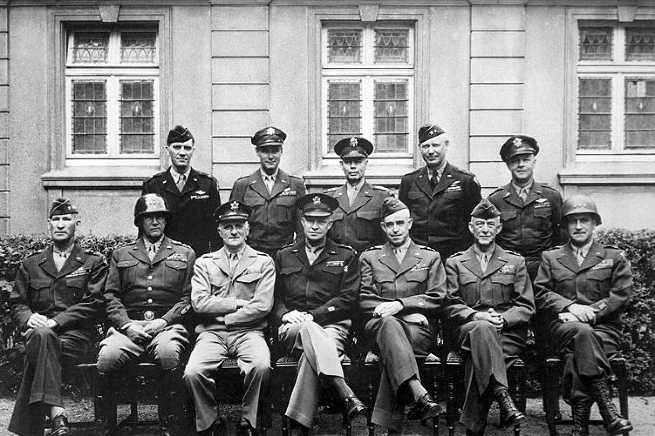Senior American commanders of the European theater of World War II, circa 1945. Seated are (from left to right) Gens. William H. Simpson, George S. Patton, Carl A. Spaatz, Dwight D. Eisenhower, Omar Bradley, Courtney H. Hodges and Leonard T. Gerow; standing are (from left to right) Gens. Ralph F. Stearley, Hoyt Vandenberg, Walter Bedell Smith, Otto P. Weyland and Richard E. Nugent. Credit: U.S. Army via Wikimedia Commons.