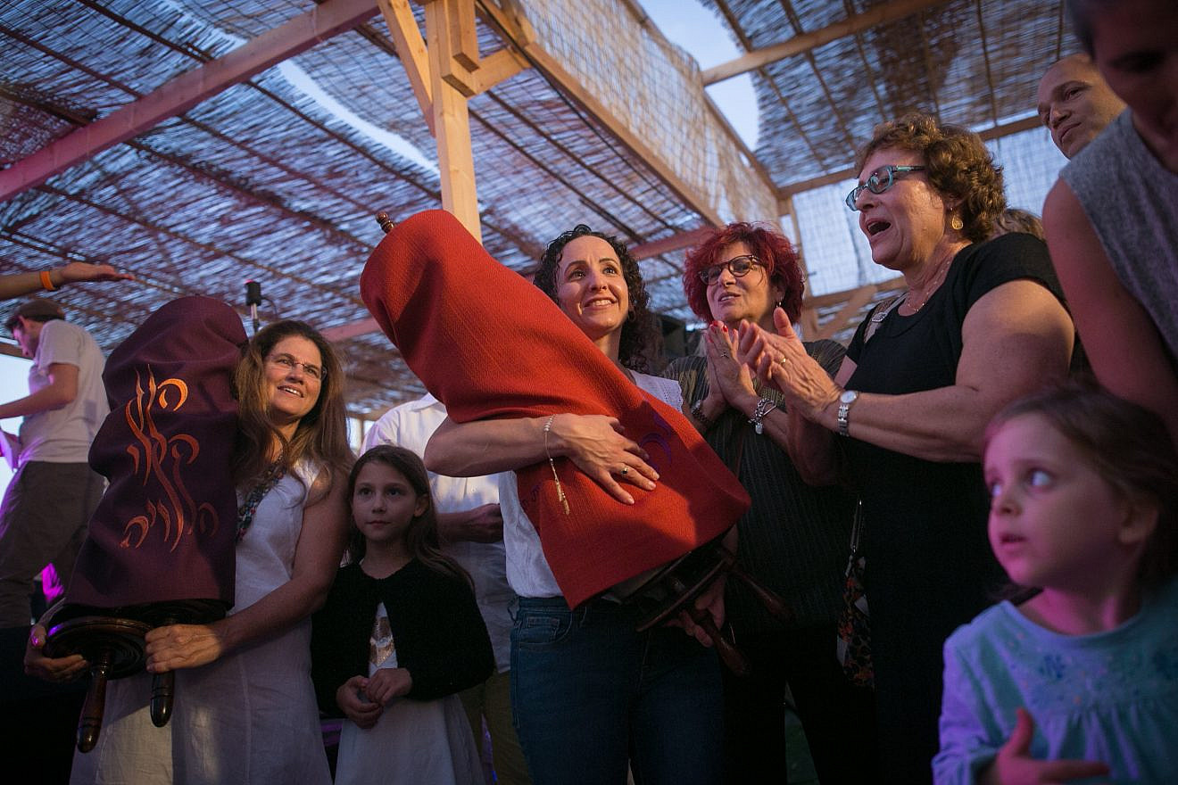 Simchat Torah celebrations inside a “sukkah” at the Tel Aviv port, organized by the Beit Tefila Israeli community. Photo by Miriam Alster/Flash90.