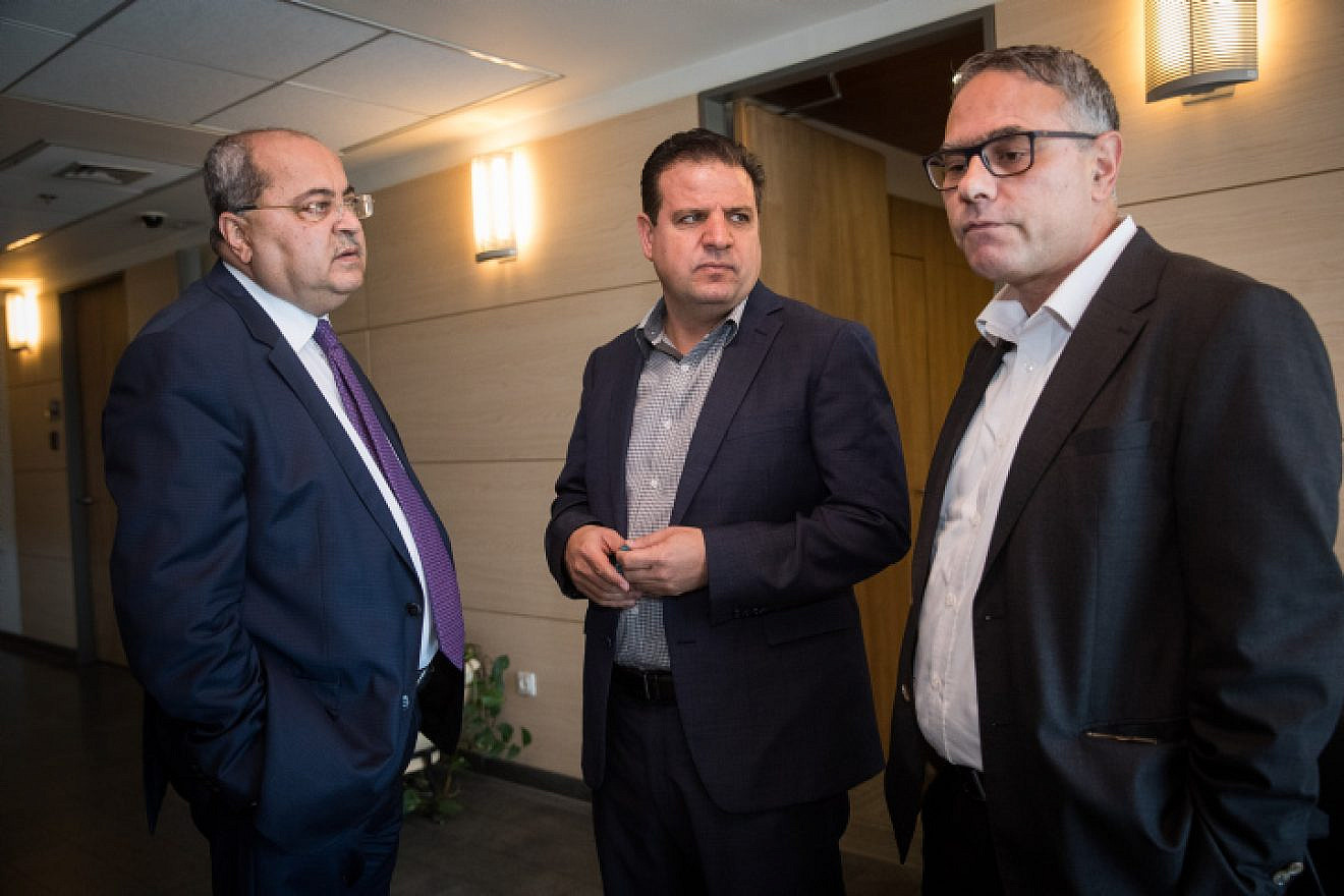 Joint Arab List leader Ayman Odeh (center) and party members Ahmad Tibi (left) and Mtanes Shehadeh arrive for a meeting at the Knesset on Sept. 22, 2019. Photo by Yonatan Sindel/Flash90.