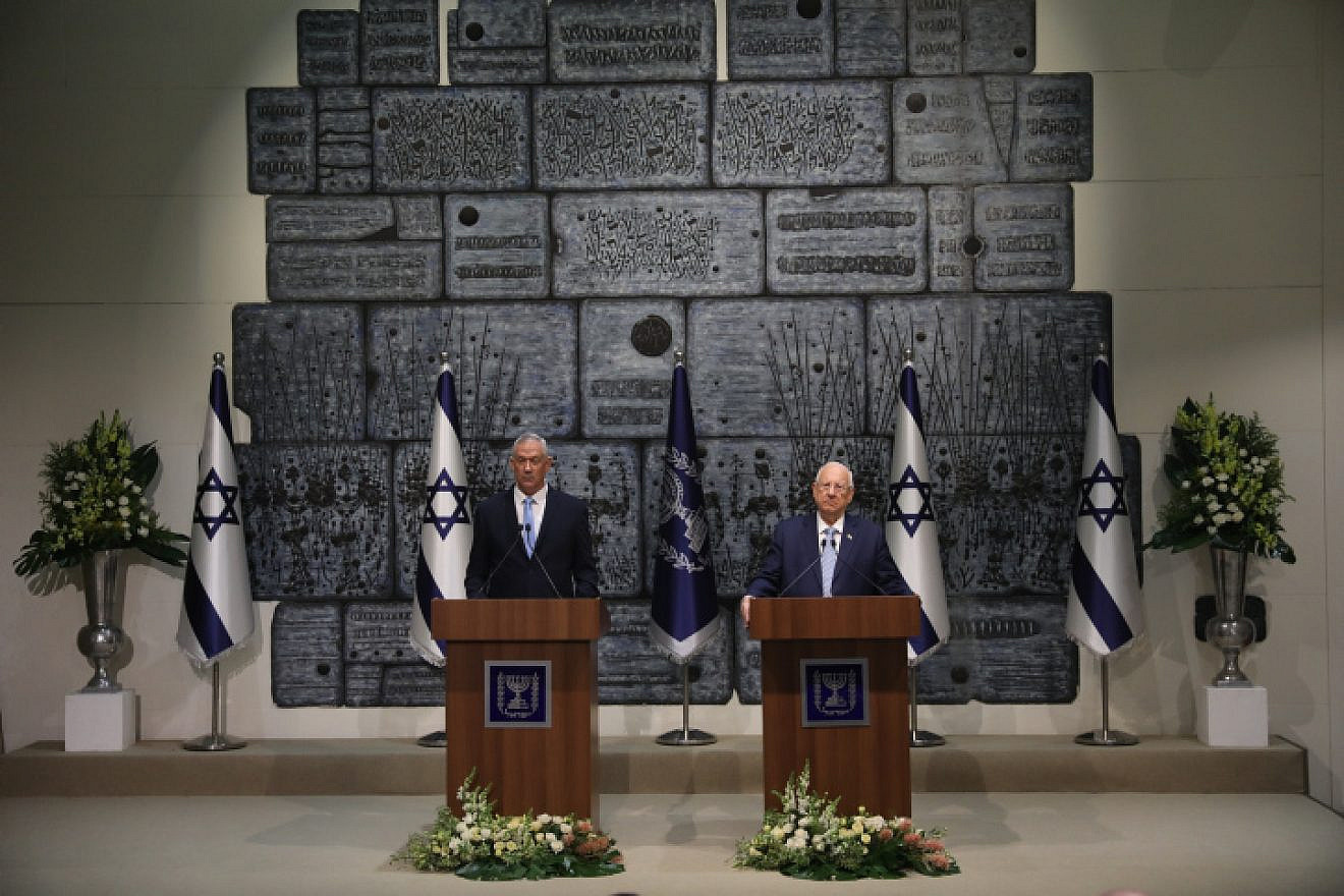Israeli President Reuven Rivlin presents Blue and White Party leader Benny Gantz with the mandate to form a new Israeli government, after Prime Minister Benjamin Netanyahu's failure to form one, at the President's Residence in Jerusalem on Oct. 23, 2019. Photo by Yonatan Sindel/Flash90.