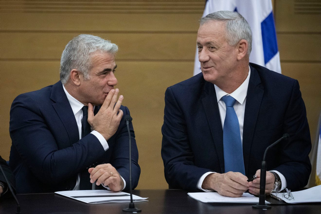 Then-Blue and White Party leaders Yair Lapid (left) and Benny Gantz attend a faction meeting at the opening of the 22nd Knesset in Jerusalem, Oct. 3, 2019. Photo by Hadas Parush/Flash90.