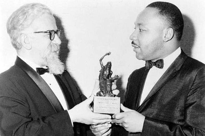 Rabbi Abraham Joshua Heschel with Dr. Martin Luther King Jr. Source: Wikimedia Commons.