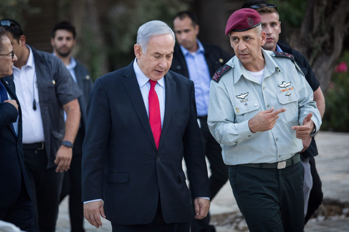Israeli Prime Minister Benjamin Netanyahu speaks with IDF Chief of Staff Lt. Gen. Aviv Kochavi during an event honoring outstanding IDF reservists, at the President's Residence in Jerusalem on July 1, 2019. Photo by Hadas Parush/Flash90.