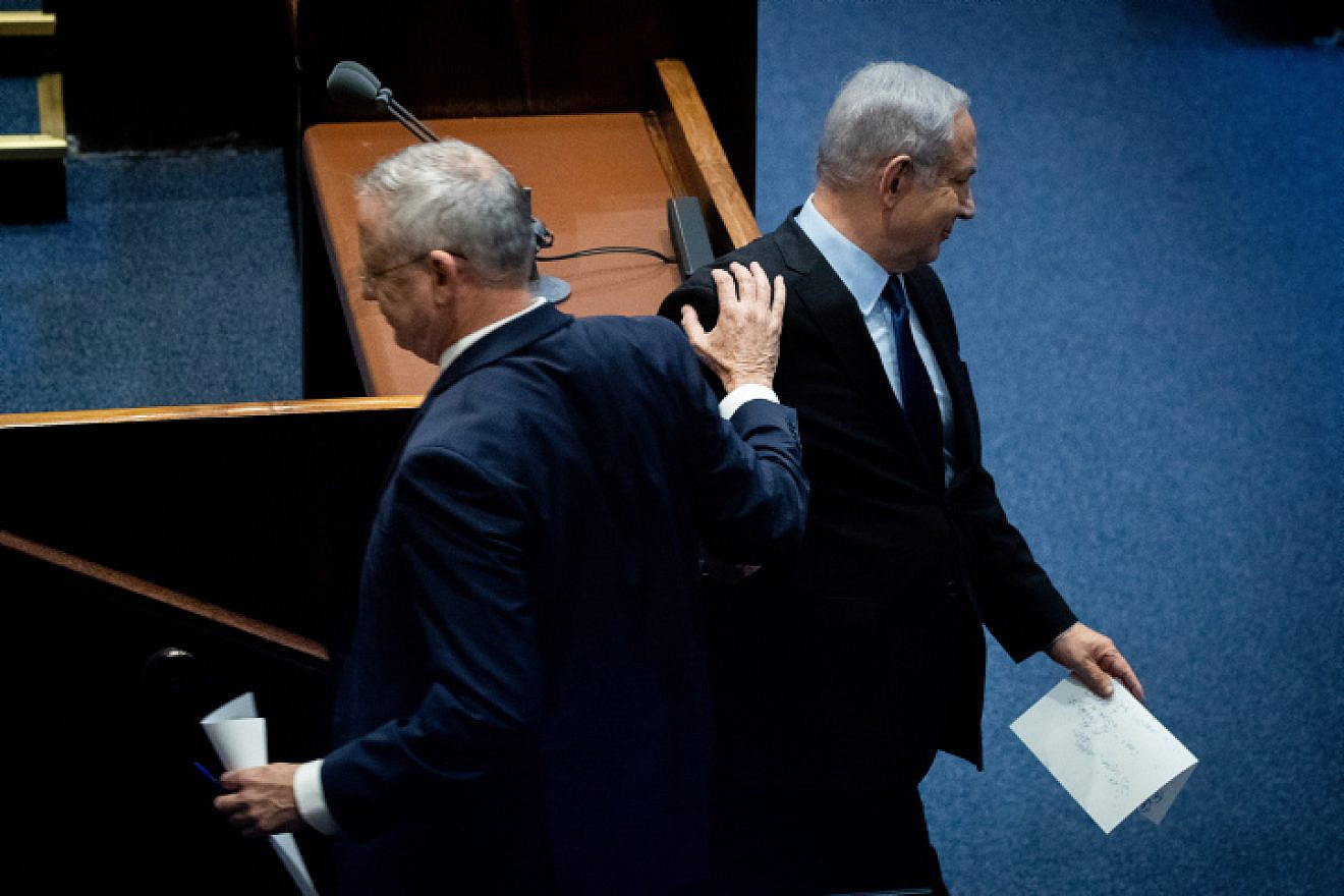 Blue and White Party leader Benny Gantz passes Israeli Prime Minister Benjamin Netanyahu at a memorial ceremony in the Knesset marking 24 years since the assassination of former Israeli Prime Minister Yitzhak Rabin, on Nov. 10, 2019. Photo by Yonatan Sindel/Flash90.
