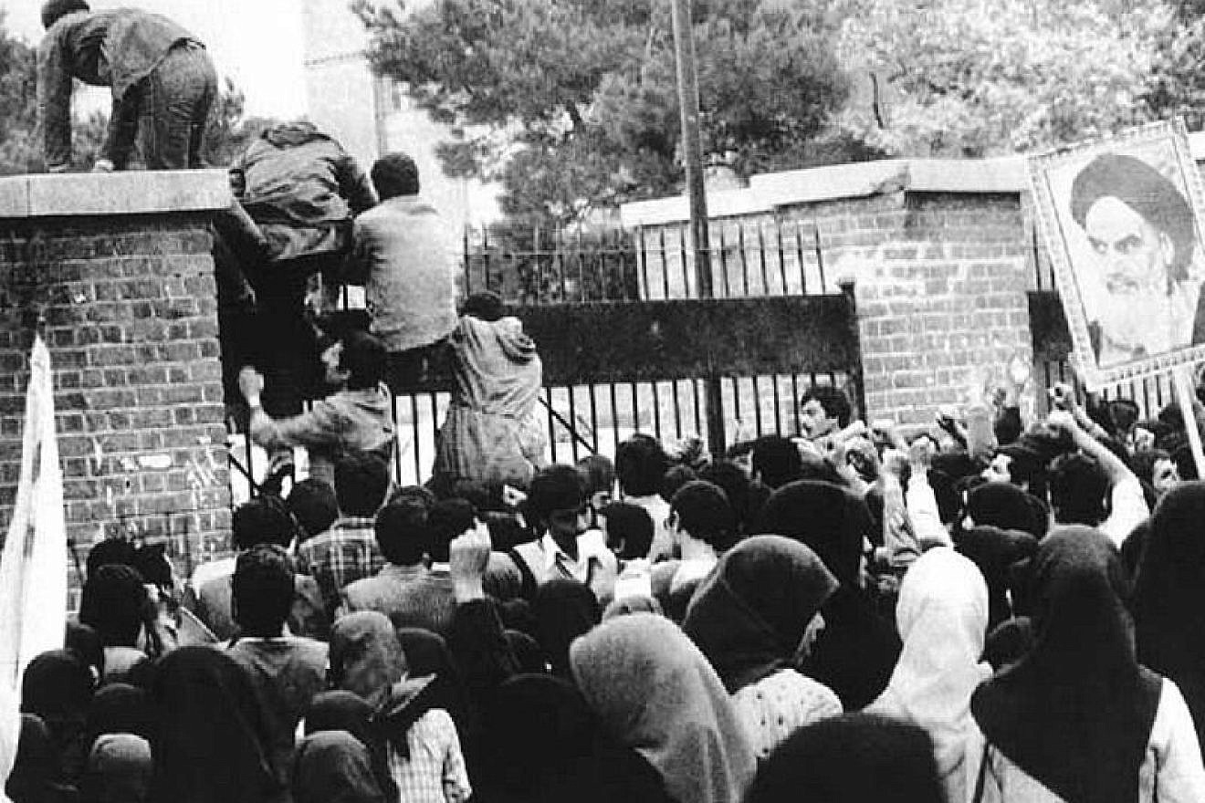 Iranian students breach the fence of the U.S. embassy in Tehran on Nov. 4, 1979. Credit: Wikimedia Commons.