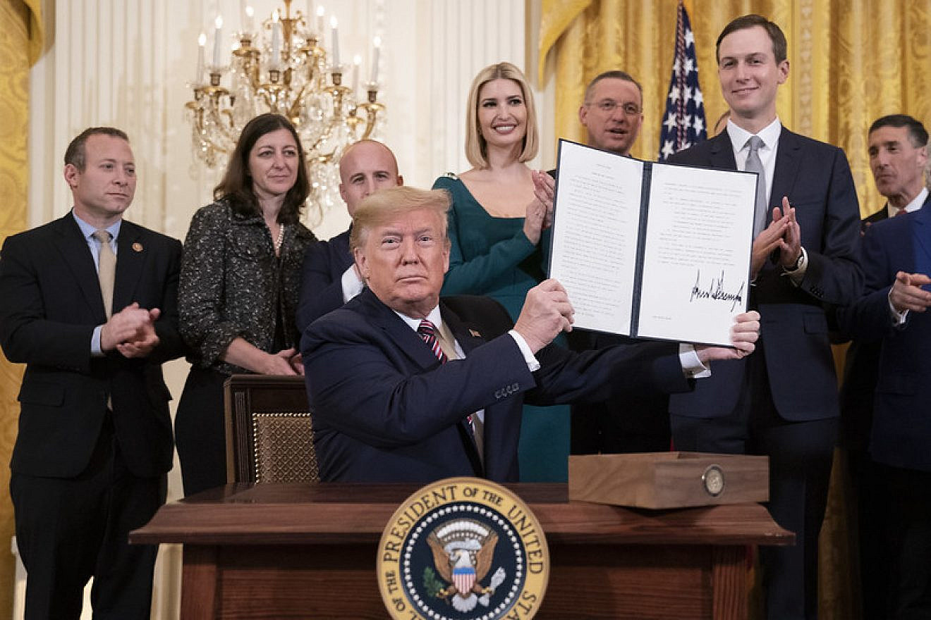 U.S. President Donald Trump displays his signature on an Executive Order committing his administration to combating the rise of anti-Semitism during an afternoon Hanukkah reception in the East Room of the White House on Dec. 11, 2019. Credit: Official White House Photo by Joyce N. Boghosian.