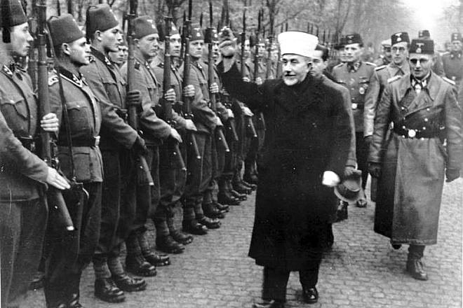 The Grand Mufti of Jerusalem Haj Amin al-Husseini salutes the Bosnian Waffen S.S. in November 1943. Credit: Bundesarchiv via Wikimedia Commons.