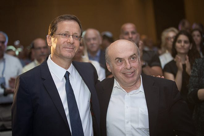 Incoming Jewish Agency chairman Isaac Herzog with outgoing chairman Natan Sharansky at the board of governors conference of the Jewish Agency at the Orient Hotel in Jerusalem on June 24, 2018. Photo by Hadas Parush/Flash90.