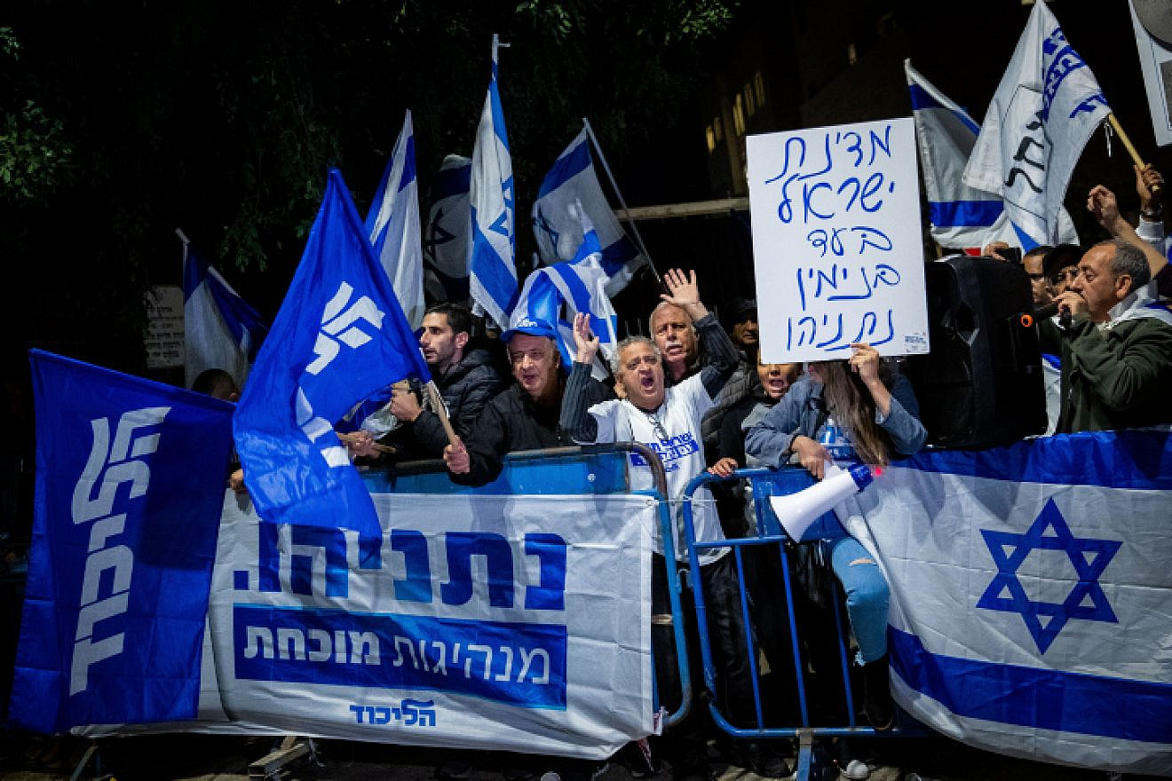 Supporters of Israeli Prime Minister Benjamin Netanyahu show their support outside the Prime Minister's Residence in Jerusalem on Nov. 30, 2019, following the announcement by Attorney General Avichai Mandelblit that Netanyahu will stand trial for bribery, fraud and breach of trust. Photo by Yonatan Sindel/Flash90.