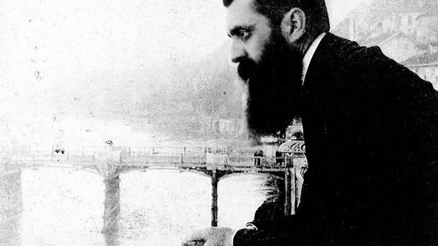 Theodor Herzl, considered the father of modern-day Zionism, leans over the balcony of the Hotel Les Trois Rois (Three King's Hotel/Hotel drei Könige) in Basel, Switzerland, possibly during the sixth Zionist conference there. Credit: The Bettman Archive.