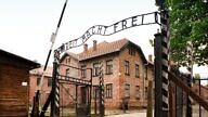 The “Arbeit Macht Frei” gate at Auschwitz with the bitter irony of the German words: “Work Will Set You Free.” Credit: Wikimedia Commons.