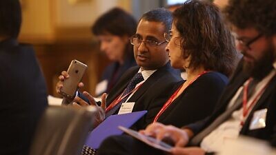 U.N. Special Rapporteur Ahmed Shaheed (center) attends a summit in London, Oct. 20, 2016. Source: U.K. Foreign and Commonwealth Office via Wikimedia Commons.