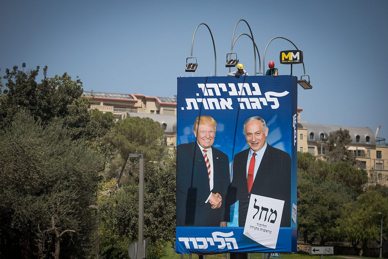 Israeli workers hang a large billboard with pictures of U.S. President Donald Trump and Israeli Prime Minister Benjamin Netanyahu, as part of the Likud election campaign, in Jerusalem on Sept. 4, 2019. Photo by Yonatan Sindel/Flash90.
