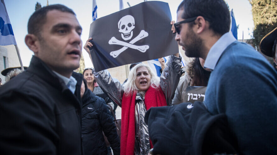 Supporters of Israeli Prime Minister Benjamin Netanyahu and activists protest against the Israeli legal system outside a hearing at the Supreme Court in Jerusalem, on Dec. 31, 2019. Photo by Yonatan Sindel/Flash90.