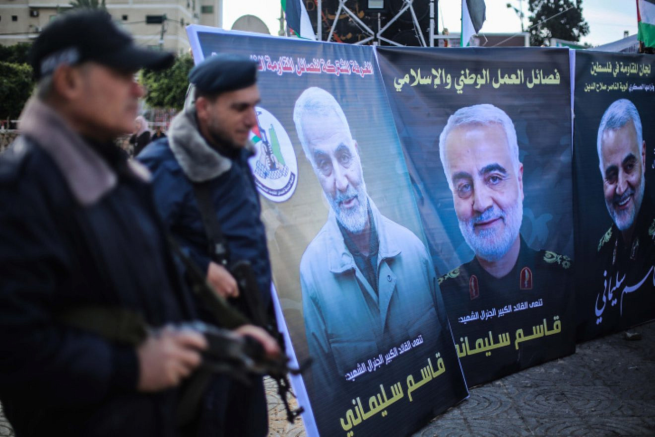 Palestinians in Gaza City walk next to posters of Qassem Soleimani, who was killed in a U.S. drone strike in Iraq a day earlier. Jan. 4, 2020. Photo by Hassan Jedi/Flash90.