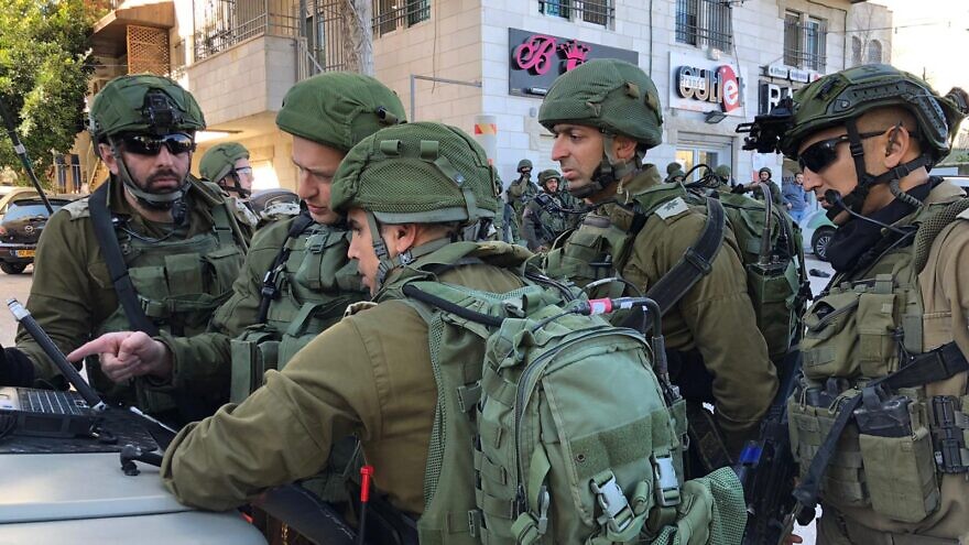 The Israel Defense Forces’ Commanding Officer of the “Efraim” Regional Brigade, Col. Yiftach Norkin, the Commanding Officer of the “Judea” Regional Brigade, Col. Itamar Ben Haim, and troops from the scene of the pursuit after the assailant who committed the car-ramming attack, Feb. 6, 2020. Credit: IDF Spokesperson’s Unit.