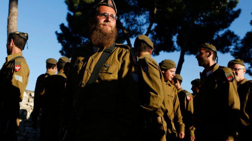 Religious Jewish soldiers attend a swearing-in ceremony as they enter the orthodox Jewish IDF "Nahal Haredi" unit, at Ammunition Hill in Jerusalem on May 26, 2012. Photo by Miriam Alster/Flash90.