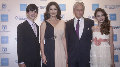 Actor Michael Douglas, actress Catherine Zeta-Jones and their children at the Red Carpet entrance to the Genesis Award ceremony at the Jerusalem Theater, the year Douglas was presented the award, June 18, 2015. Photo by Marc Israel Sellem/POOL.
