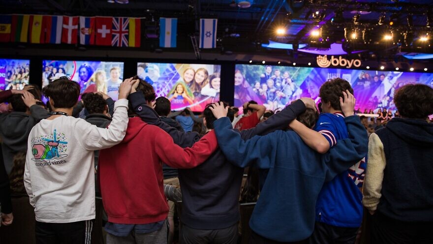 Teens embrace during a Havdalah ceremony at the BBYO International Convention in February 2020. Photo by Jason Dixson Photography.