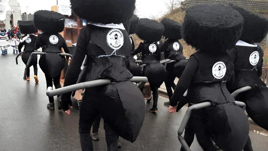 Participants dressed as Chassidic Jews resembling the form of ants at the annual Aalst Carnival in Belgium, which has been accused of rampant anti-Semitism. Source: YouTube.