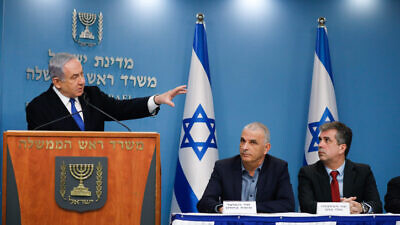 Israeli Prime Minister Benjamin Netanyahu holds a press conference with Finance Minister Moshe Kahlon, Economics Minister Eli Cohen and Bank of Israel head Amir Yaron (not pictured) on economic preparations for the financial fallout of the COVID-19 crisis, March 12, 2020. Photo by Olivier Fitoussi/Flash90.