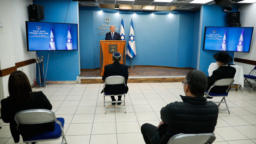 Israeli Prime Minister Benjamin Netanyahu speaks while social distancing during a press conference about the coronavirus (COVID-19), at the Prime Minister's office in Jerusalem on March 25, 2020. Photo by Olivier Fitoussi/Flash90.