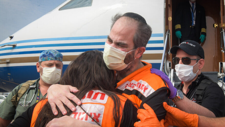 United Hatzalah CEO Eli Beer arrives at Ben-Gurion International Airport near Tel Aviv by private jet after recovering from COVID-19 at a hospital in Miami, April 21, 2020. Photo by Yehuda Haim/Flash90.