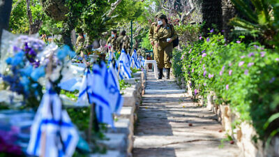 Soldiers at the Kiryat Shaul Military Cemetery in Tel Aviv as Israel marks Memorial Day for Fallen Soldiers and Victims of Terrorism, April 28, 2020. Photo by Avshalom Sassoni/Flash90.