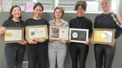 Students from the University of Haifa's Innovation Hub for Holocaust Education and Commemoration pose with plaques describing their individual projects. Credit: University of Haifa.