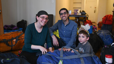 The Karoly family in New York packing up to move to Israel. Credit: Courtesy.