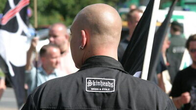 A neo-Nazi skinhead with a patch in German that reads “Skinheads, White and proud,” Aug. 19, 2006. Photo: Marek Peters via Wikimedia Commons.