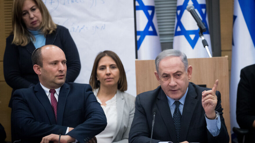 Israeli Prime Minister Benjamin Netanyahu speaks with Israeli Defense Minister Naftali Bennett during a meeting with the heads of the right-wing parties following the results of Israel's March 3 elections, on March 4, 2020. Photo by Yonatan Sindel/Flash90.