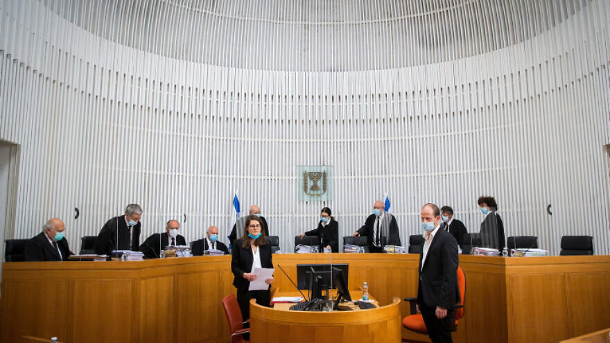 Israeli Supreme Court president Esther Hayut and Supreme Court Justices arrive to a second-day court session on petitions against the coalition agreement between Gantz's Blue and White Party and Netanyahu's Likud Party at the Supreme Court in Jerusalem on May 3, 2020. Photo by Oren Ben Hakoon/POOL.