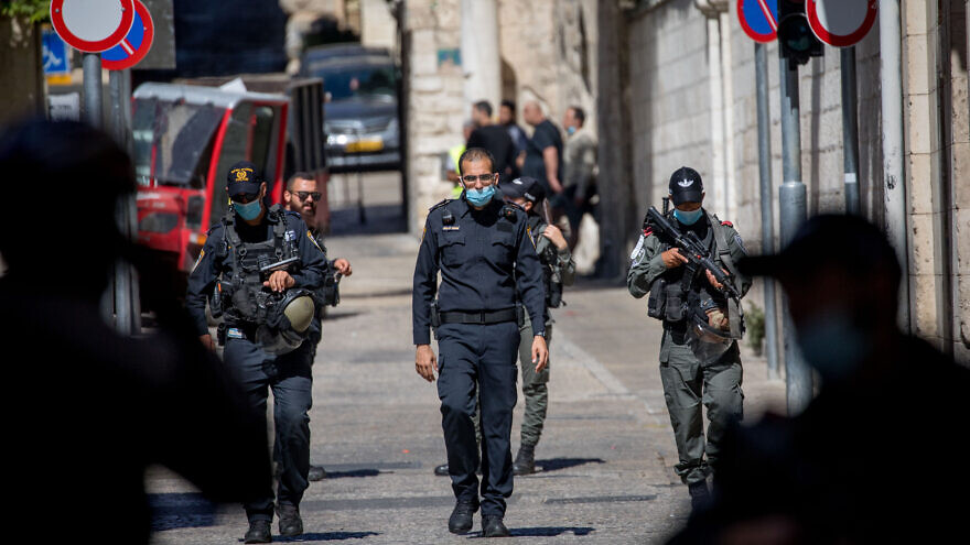 Israel Police guard the scene of the shooting of Iyad Halak at the Lions' Gate in Jerusalem's Old City on May 30, 2020. Photo by Yonatan Sindel/Flash90.